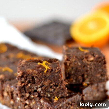 Homemade Chocolate Orange Larabar Bites (vegan, gluten free) displayed in a neat stack, ready to be eaten.