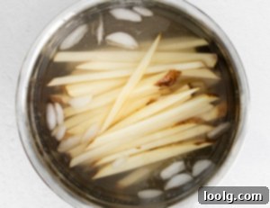 Air Fryer Garlic Fries in ice water
