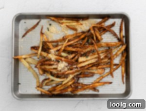 Air Fryer Garlic Fries on baking tray
