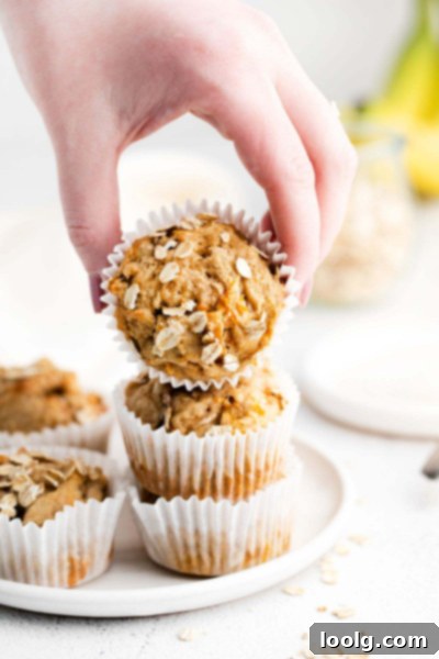 hand picking up banana carrot muffins