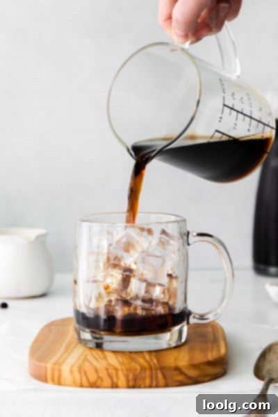 cold brew being poured into cup
