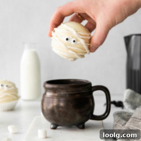 hand holding halloween hot chocolate bomb