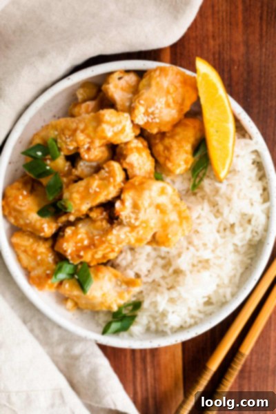 Air Fryer Orange Chicken served with rice and broccoli