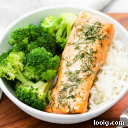 Close-up of a bowl with a filet of air fryer salmon, broccoli, and rice for a healthy meal