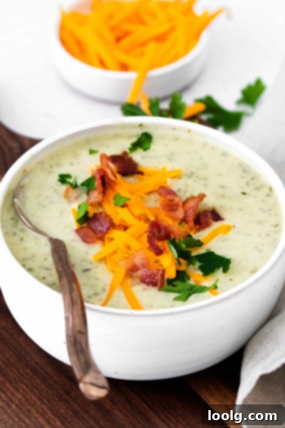 A bowl of creamy Instant Pot Colcannon Potato Soup garnished with crispy bacon and fresh parsley.