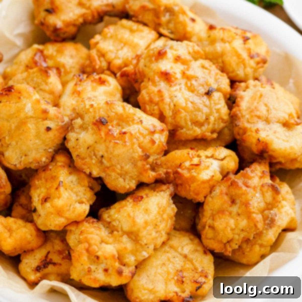 Crispy popcorn chicken served on a plate
