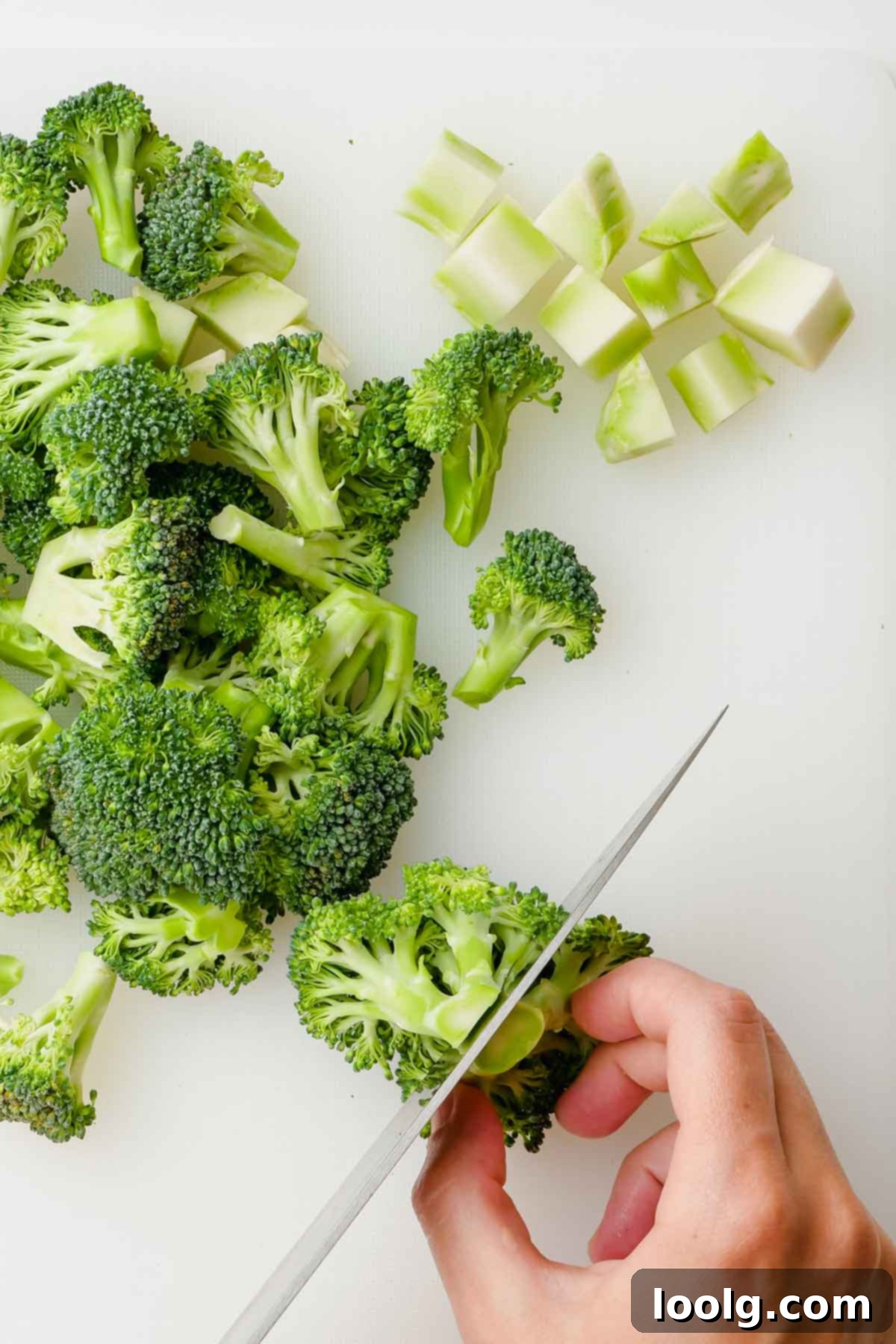cutting a broccoli floret in half