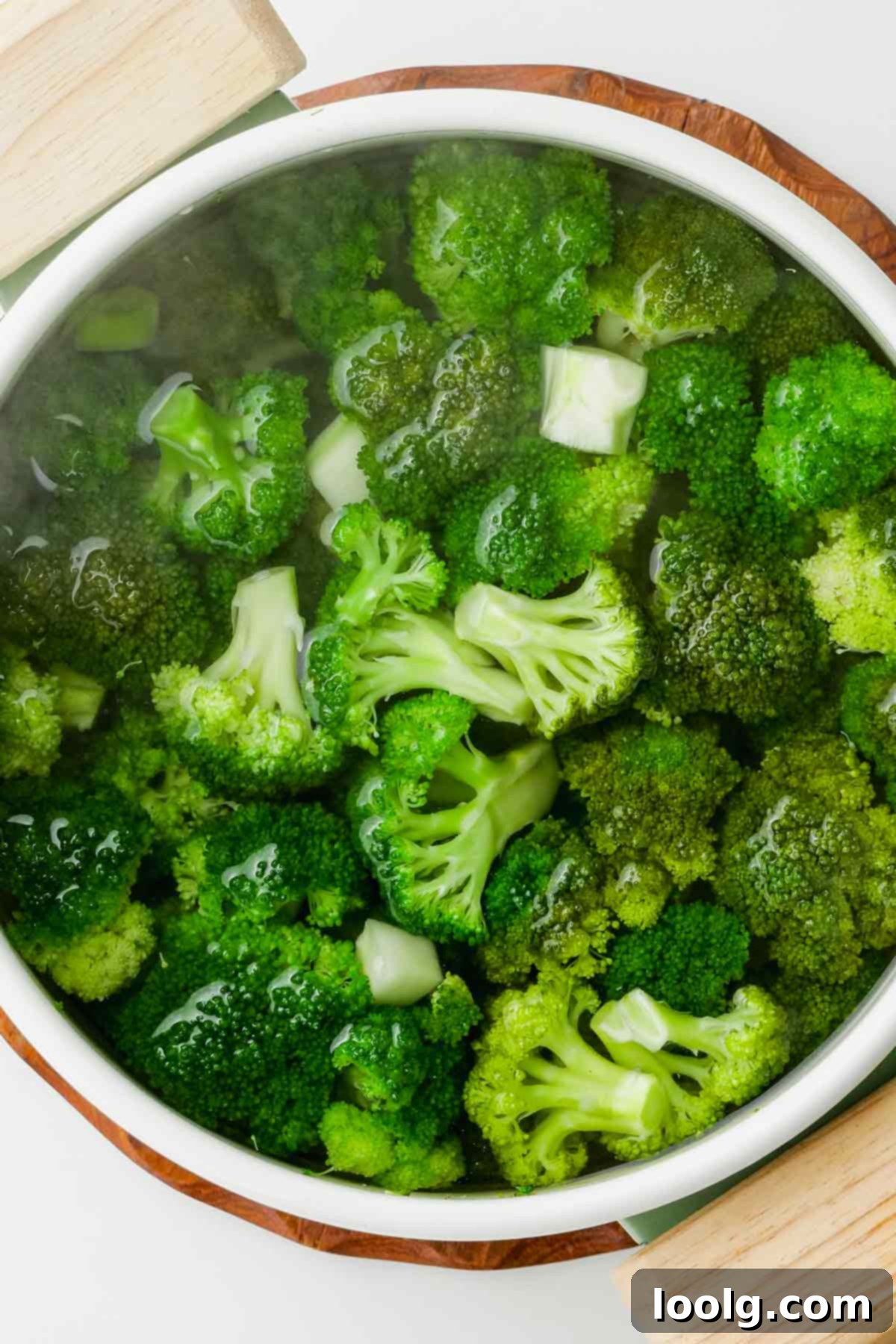 broccoli florets in pot of boiling water