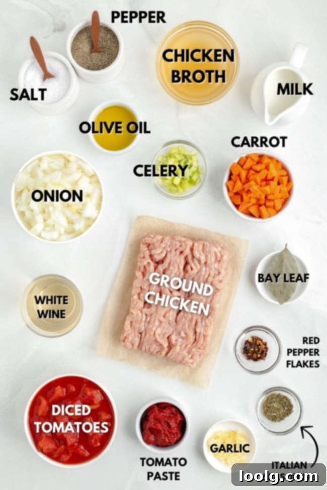 A close-up shot of fresh, colorful ingredients laid out on a cutting board, ready for chicken bolognese preparation.