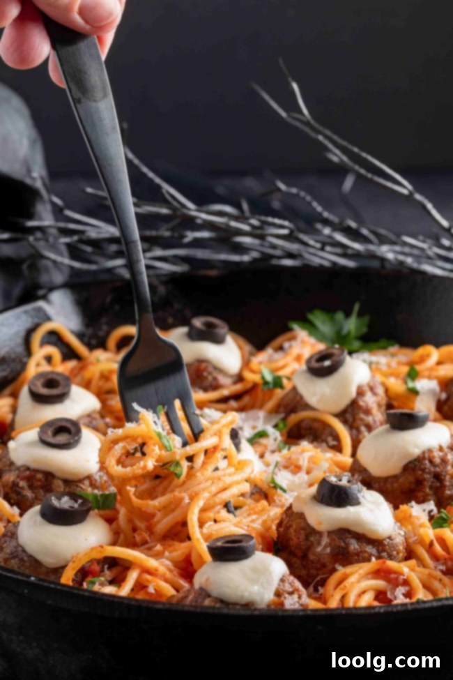 Raw Halloween Meatballs arranged on a baking sheet