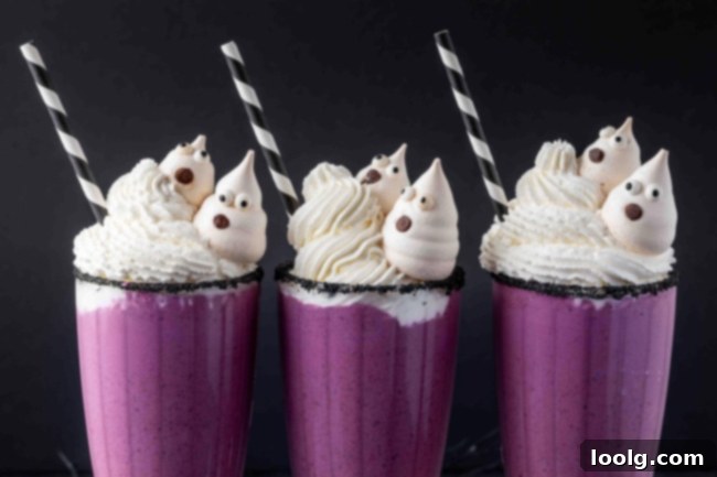 A final image of a Halloween milkshake, showing the vibrant purple color and festive topping.
