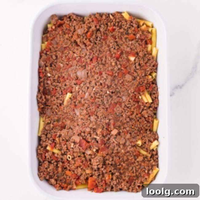 another layer of sauce on top of the noodles
