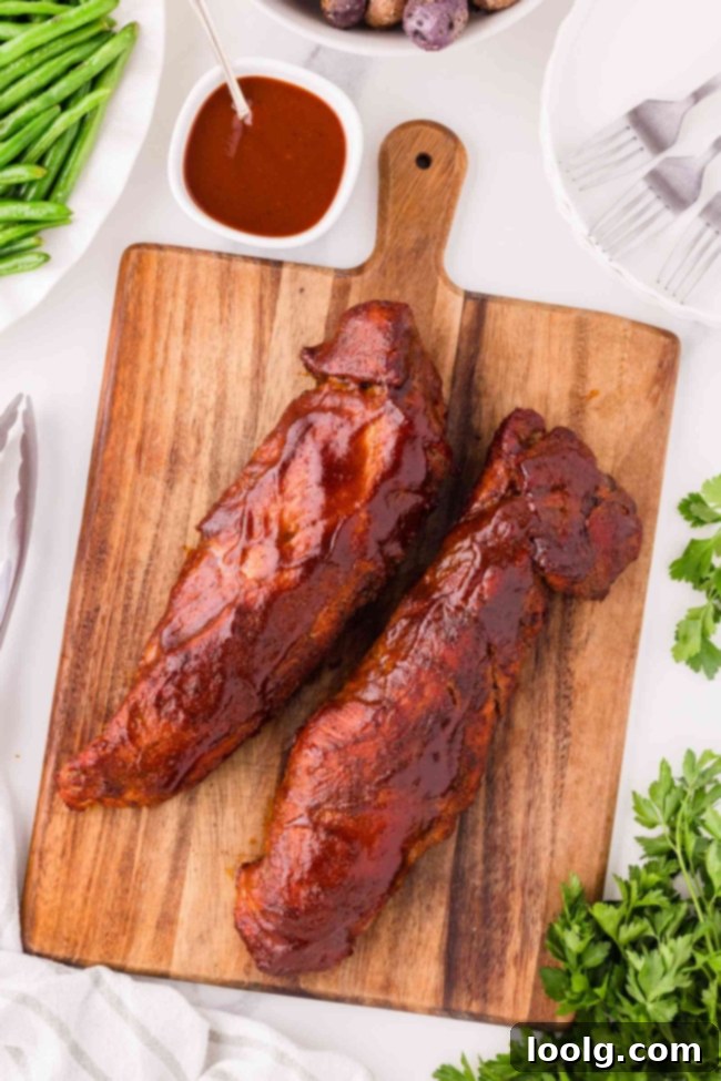 2 pork tenderloins on a wooden cutting board