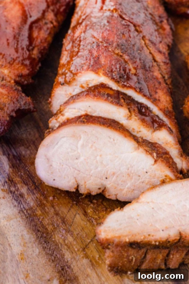 smoked pork tenderloin on a wooden cutting board