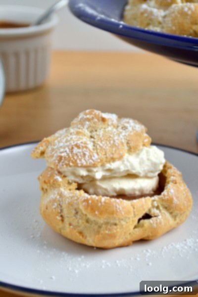 Delicious Whole Wheat Cream Puffs with Chocolate Peanut Butter Filling, dusted with powdered sugar