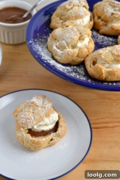 Close-up of a halved Whole Wheat Cream Puff showing the chocolate peanut butter filling and whipped cream