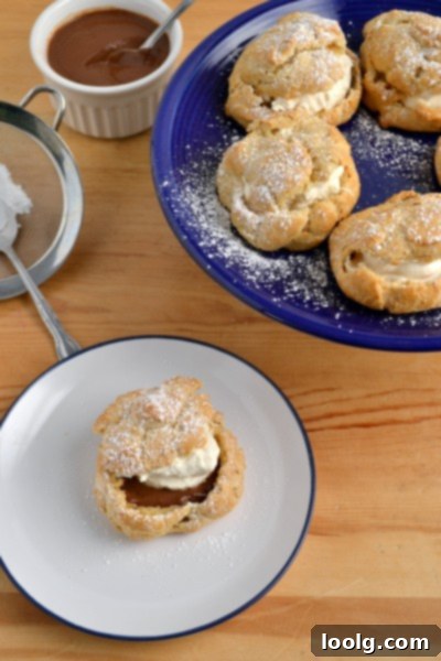 A whole wheat cream puff split open, showing the internal cavity ready for filling