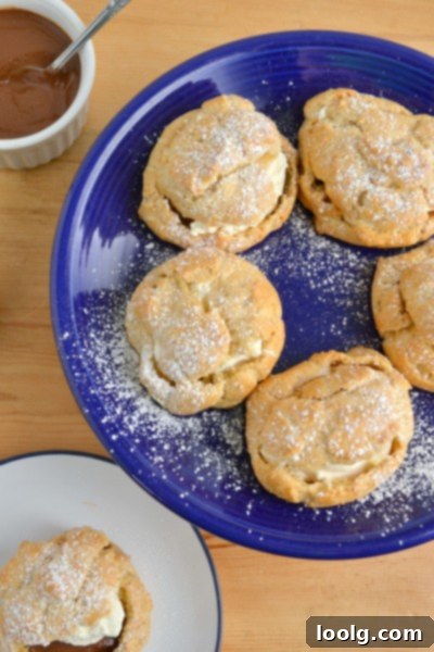 A collection of baked whole wheat cream puff shells ready for filling