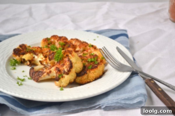 A vibrant close-up of Cajun roasted cauliflower florets, showcasing the golden-brown seasoning and crispy texture.