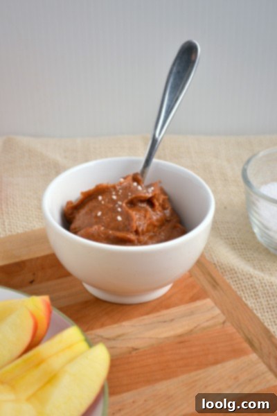 Luscious Raw Vegan Cinnamon Spiced Salted Caramel dripping off a spoon