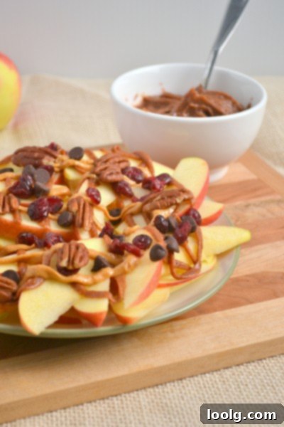 A vibrant plate of apple nachos, showcasing diverse toppings