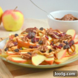 A smaller image of apple nachos with caramel drizzle and various toppings