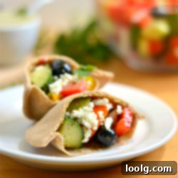 Mini Greek Salad Pita Pizzas and Stuffed Pitas on a serving platter