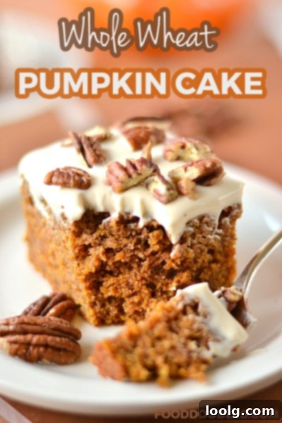 Wholesome Pumpkin Spice Cake with Tangy Greek Yogurt Frosting 1 Moist Whole Wheat Pumpkin Cake with Lighter Greek Yogurt Cream Cheese Frosting on a White Plate