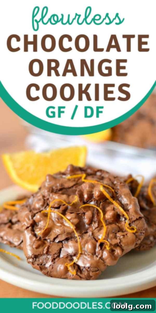 Zesty Orange Chocolate Lava Puddles 2 Flourless Chocolate Orange Cookies (gluten-free, dairy-free) close-up on a wooden surface.