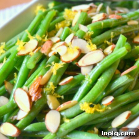 Bright Lemon Butter Green Beans with Toasted Almonds 1 image of lemon butter fresh green beans with almond slivers