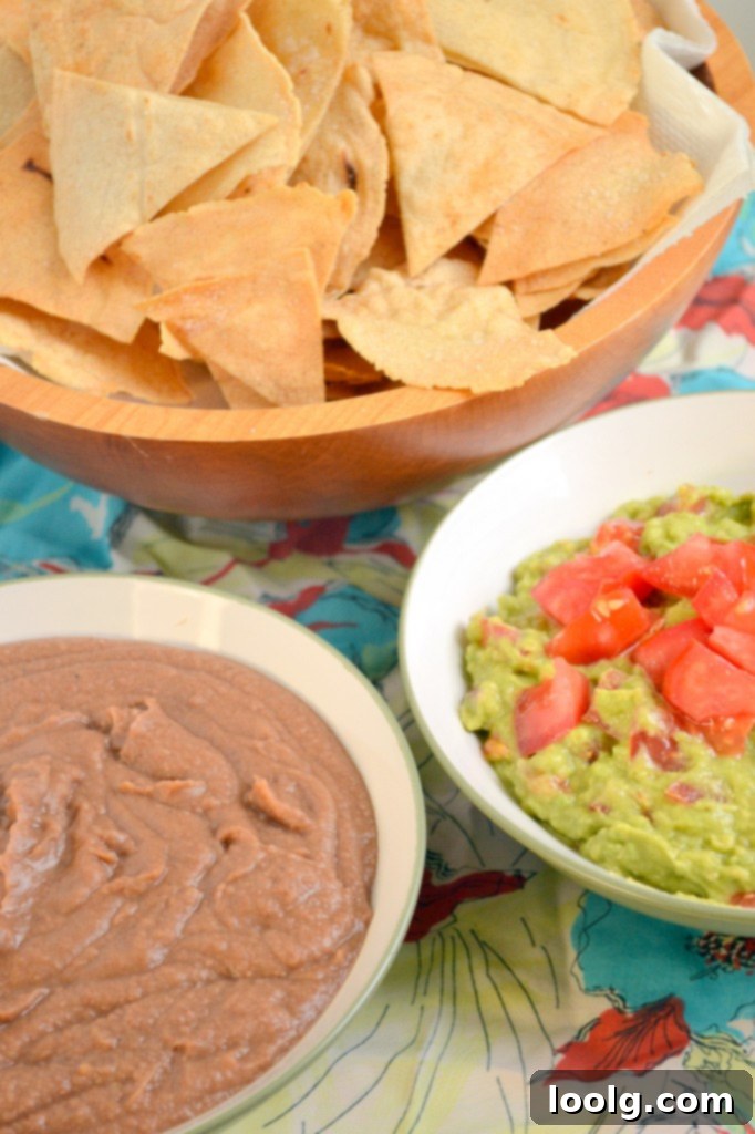 Refried Beans and Guacamole with Crispy Chips Refried Beans and Guacamole with crispy homemade tortilla chips