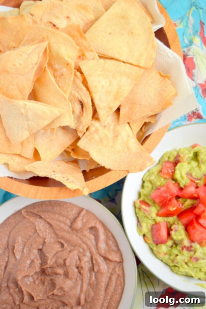 Complete Refried Beans and Guacamole Spread Full spread of Refried Beans, Guacamole, and homemade chips