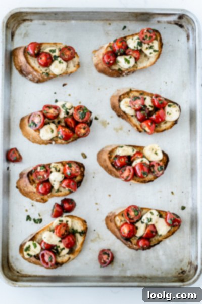 Sun-Ripened Tomato Mozzarella Bruschetta 5 Preparing bruschetta: adding tomato and mozzarella topping to toasted bread