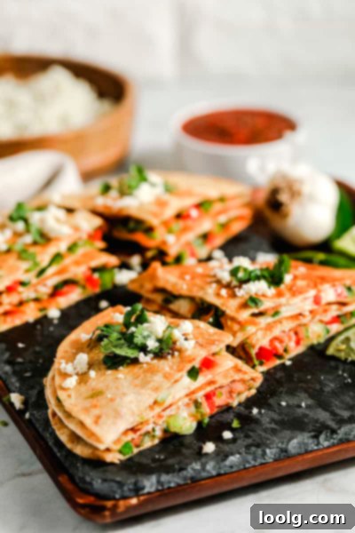 Little Bites for Little Ones 9 Vegetarian Quesadillas - half-moon shaped quesadillas on a plate