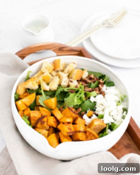Goat Cheese Sweet Potato Medley 4 Sweet Potato Goat Cheese Salad in a bowl with a napkin, showcasing the vibrant ingredients