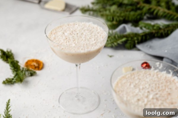 Frosted Yuletide Delight 7 White Christmas Cocktail with Christmas decorations in the background