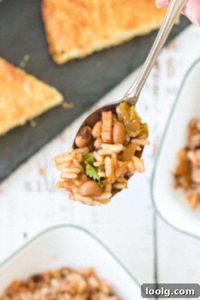 Lucky Slow Cooker Hoppin' John 5 Hoppin' John served with cornbread and greens, a traditional New Year's meal.