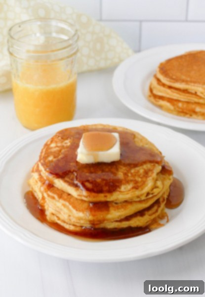 Golden Cornbread Pancakes 5 Cornmeal pancakes with syrup and butter