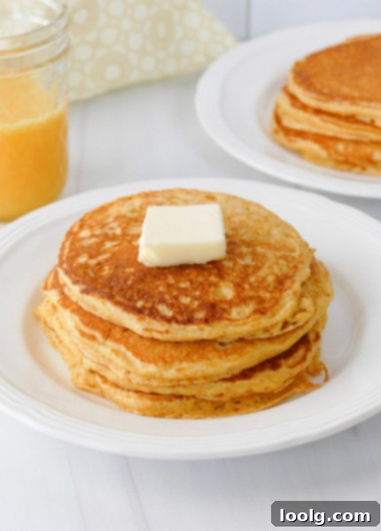 Golden Cornbread Pancakes 6 Cornmeal pancakes on plate