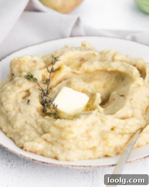 Creamy Instant Pot Colcannon 4 Colcannon on a plate with butter