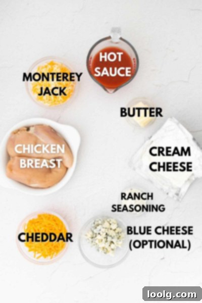 Ultimate Instant Pot Buffalo Chicken Dip 3 Fresh ingredients laid out for Instant Pot Buffalo Chicken Dip including chicken, hot sauce, cream cheese, and shredded cheeses
