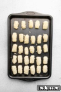 Crispy Air Fryer Tater Tots with Hash Brown Hack 11 tater tots on pan