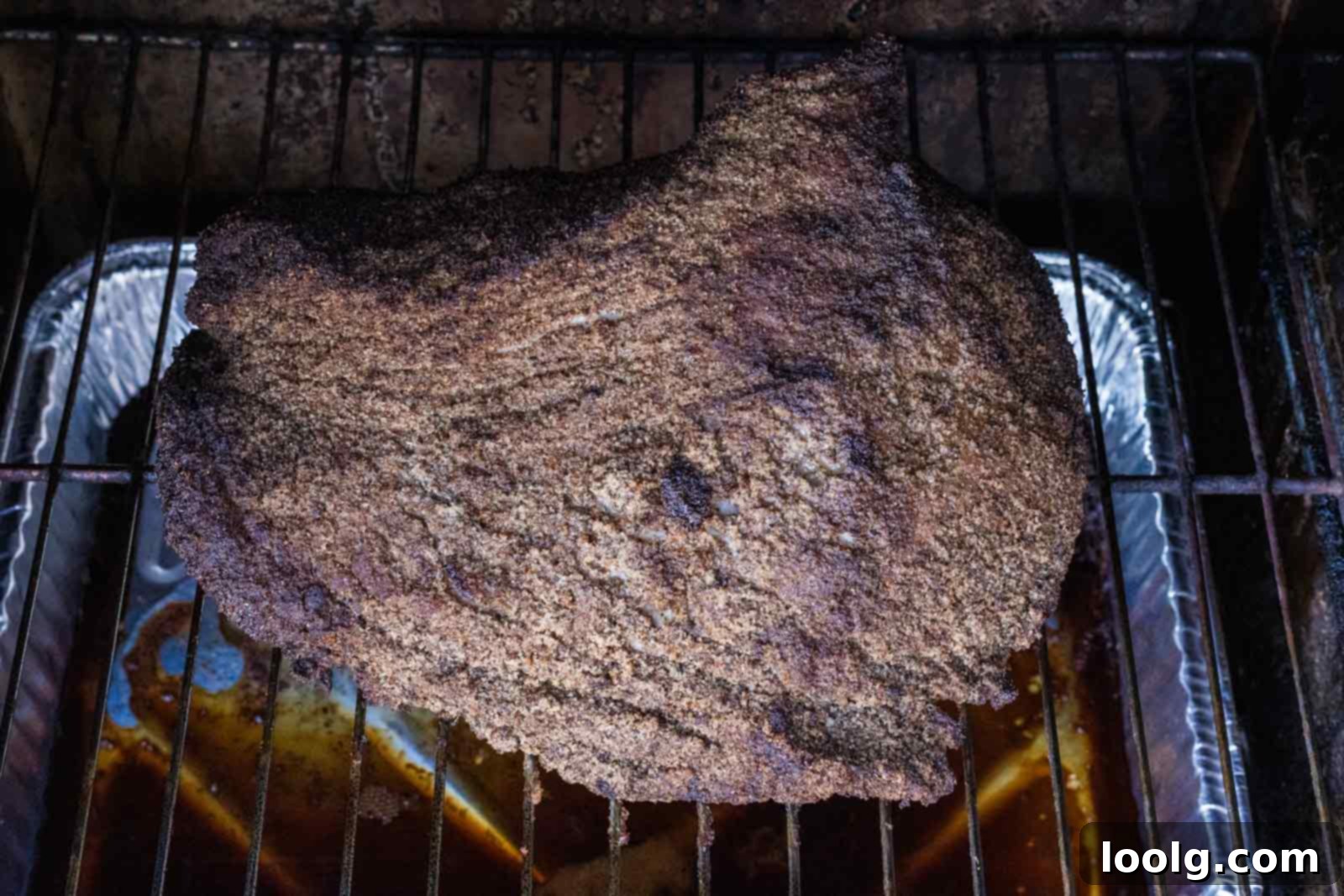 Slow-Smoked Corned Brisket 7 partially cooked corned beef brisket on the smoker grate