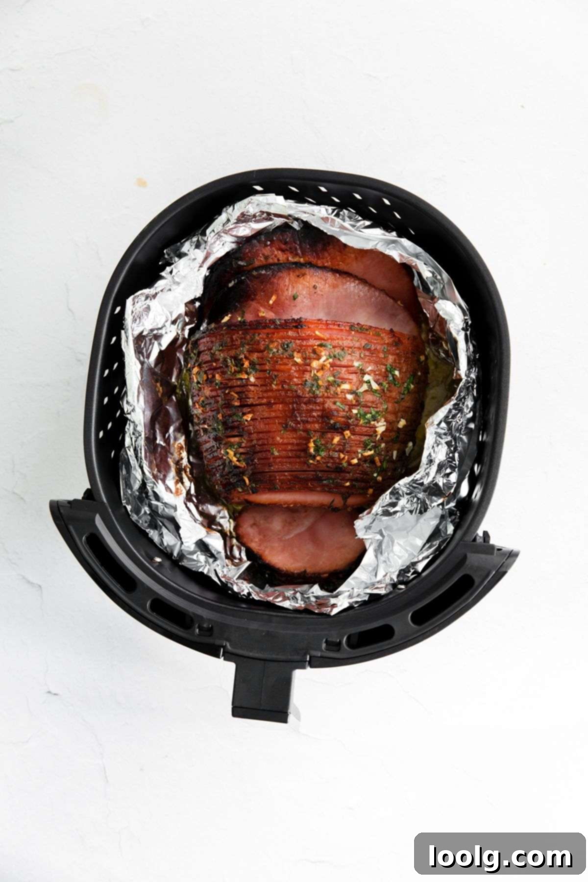 Crispy Golden Air Fryer Ham 6 ham in air fryer wrapped in foil