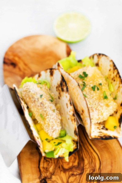 Crispy Air Fryer Fish Tacos 2 air fryer fish tacos on serving board