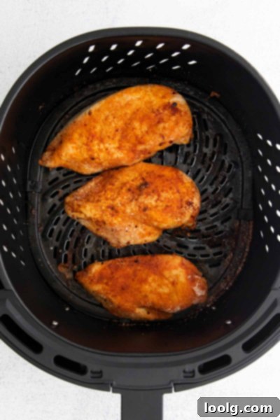 Perfect Air Fryer BBQ Chicken 5 cooked chicken breast in air fryer basket