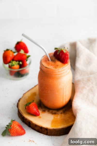 Tropical Mango Strawberry Banana Smoothie 4 Mango Strawberry Banana Smoothie in glass