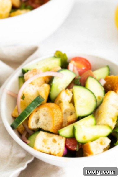 Rustic Tuscan Bread Salad 6 Toasted bread cubes, the foundation of a Panzanella salad, showcasing their golden brown and crispy texture.
