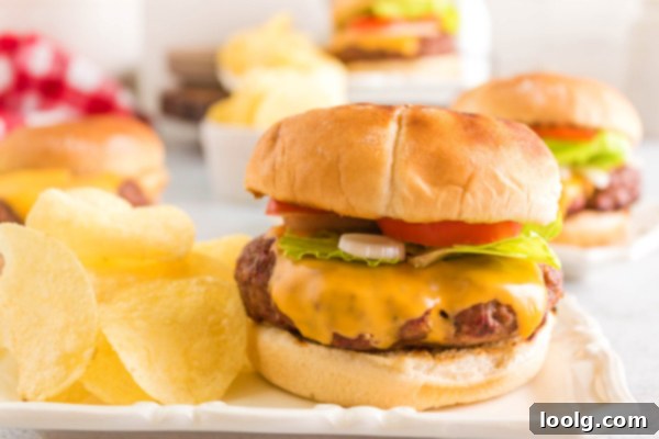 Smoky Burger Perfection 6 smoked hamburger on plate with chips and toppings
