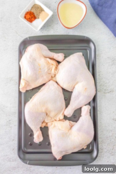 Perfectly Smoked Chicken Quarters 3 All the dry rub ingredients - salt, paprika, garlic powder, black pepper - laid out on a clean surface.